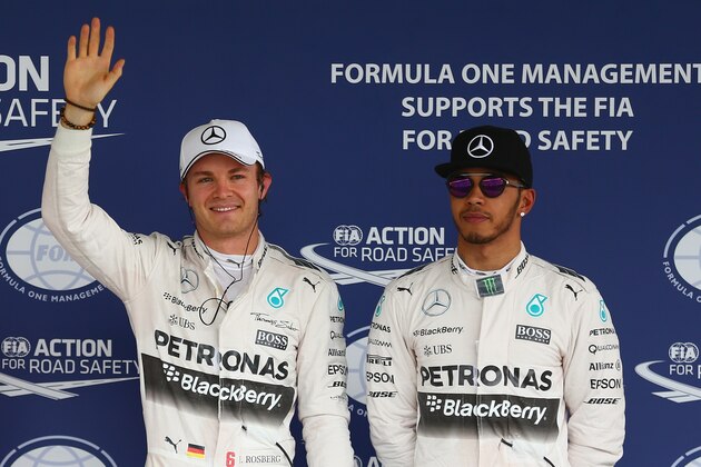 MEXICO CITY, MEXICO - OCTOBER 31:  Nico Rosberg of Germany and Mercedes GP celebrates pole position as team mate and second place driver Lewis Hamilton of Great Britain and Mercedes GP
looks on after qualifying for the Formula One Grand Prix of Mexico at Autodromo Hermanos Rodriguez on October 31, 2015 in Mexico City, Mexico.  (Photo by Clive Mason/Getty Images)