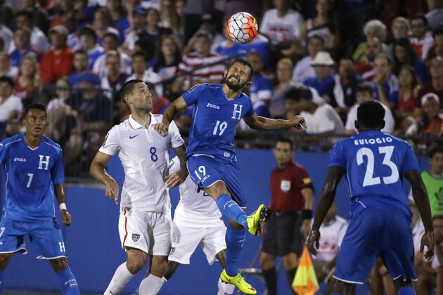 Honduras' Afredo Mejia (19) jumps for the header against U.S. forward Clint Dempsey (8) during the second half of a CONCACAF Gold Cup soccer match in Frisco, Texas, Tuesday, July 7, 2015. Looking on are Honduras' Carlos Discua (7) and Johnny Palacios. The U.S. won 2-1. (AP Photo/LM Otero)
