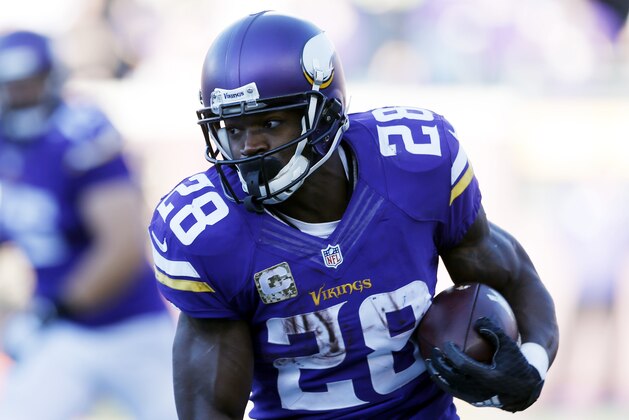 Minnesota Vikings running back Adrian Peterson (28) rushes during the second half of an NFL football game against the St. Louis Rams, Sunday, Nov. 8, 2015, in Minneapolis. (AP Photo/Jim Mone)