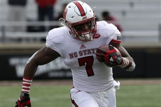 North Carolina State wide receiver Nyheim Hines (7) runs against Boston College during the first half of an NCAA college football game in Boston, Saturday, Nov. 7, 2015. (AP Photo/Charles Krupa)