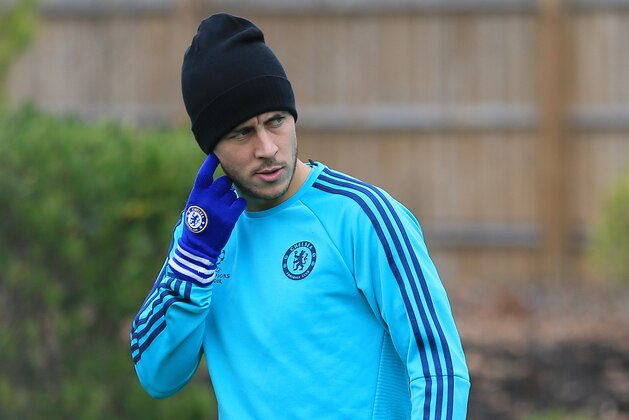 Chelsea's Eden Hazard arrives on the field during a training session at the team's training ground in Cobham, England, Tuesday Nov. 3, 2015. Chelsea will play Dynamo Kyiv in a Group G match on Wednesday. (AP Photo/Tim Ireland)