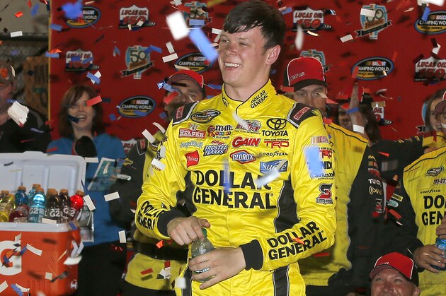 Erik Jones celebrates after winning the NASCAR Trucks auto race at Phoenix International Raceway in Avondale, Ariz., Friday, Nov. 7, 2014. The race was shortened because of two power outages. (AP Photo/Rick Scuteri)