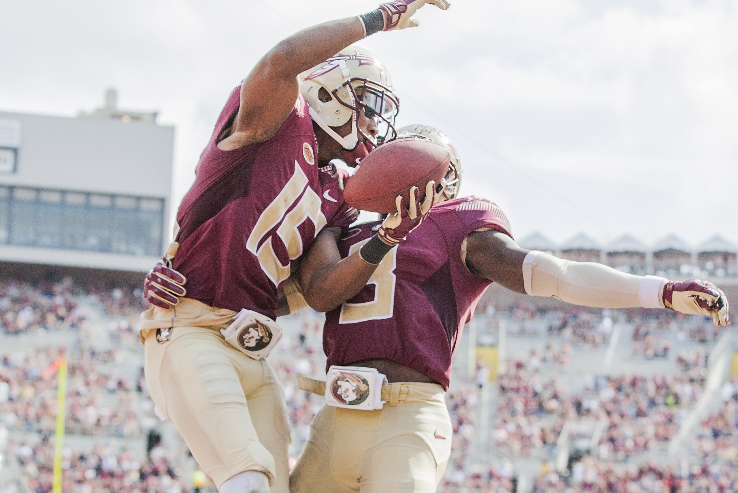 Florida State wide receiver Travis Rudolph, left, celebrates with teammate Jesus Wilson after a 19 yard touchdown reception in the second half of an NCAA college football game against Syracuse in Tallahassee, Fla., Saturday, Oct. 31.  Florida State defeated Syracuse 45-21. (AP Photo/Mark Wallheiser)