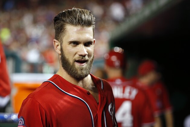 Washington Nationals right fielder Bryce Harper (34) talks in the dugout during a baseball game against the Atlanta Braves at Nationals Park, Saturday, Sept. 5, 2015, in Washington. The Nationals won 8-2. (AP Photo/Alex Brandon)