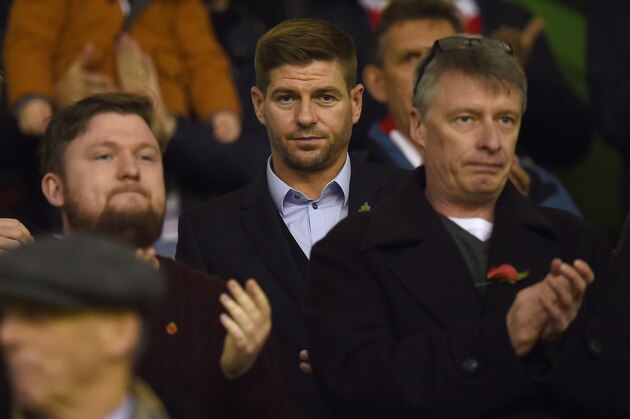 Former Liverpol player and current LA Galaxy midfielder, Steven Gerrard watches the players warm up ahead of the English Premier League football match between Liverpool and Crystal Palace at the Anfield stadium in Liverpool, north-west England on November 8, 2015.     AFP PHOTO / PAUL ELLIS

RESTRICTED TO EDITORIAL USE. No use with unauthorized audio, video, data, fixture lists, club/league logos or 'live' services. Online in-match use limited to 75 images, no video emulation. No use in betting, games or single club/league/player publications.        (Photo credit should read PAUL ELLIS/AFP/Getty Images)