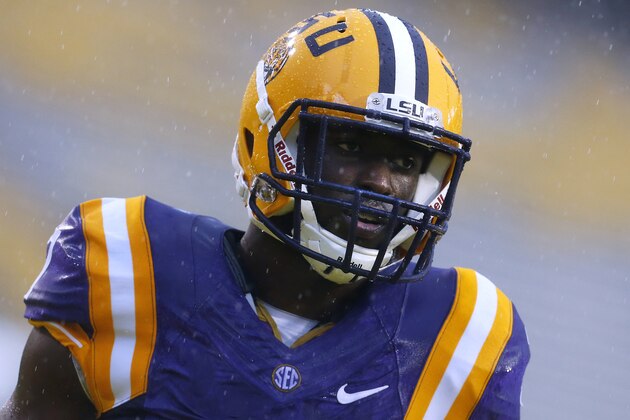 LSU running back Leonard Fournette  warms up in the rain before an NCAA college football game against Western Kentucky in Baton Rouge, La., Saturday, Oct. 24, 2015. (AP Photo/Jonathan Bachman)