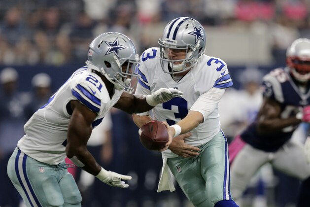 Dallas Cowboys' Brandon Weeden (3) hands off to Joseph Randle (21) during the first quarter of an NFL football game against the New England Patriots, Sunday, Oct. 11, 2015, in Arlington, Texas. (AP Photo/Tim Sharp)