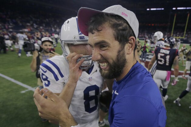 Indianapolis Colts' Andrew Luck, right, celebrates with teammate Matt Hasselbeck (8) after they defeated the Houston Texans in an NFL football game Thursday, Oct. 8, 2015, in Houston. Indianapolis won 27-20.(AP Photo/Patric Schneider)
