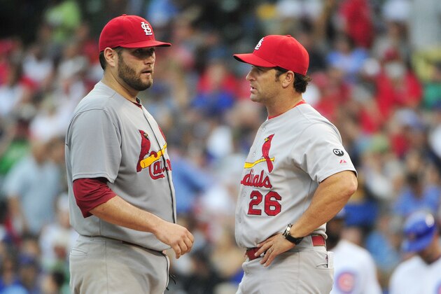 CHICAGO, IL - SEPTEMBER 18: Mike Matheny #26 manager of the St. Louis Cardinals takes Lance Lynn #31 out of the game against the Chicago Cubs during the fourth inning on September 18, 2015 at Wrigley Field in Chicago, Illinois. (Photo by David Banks/Getty Images)