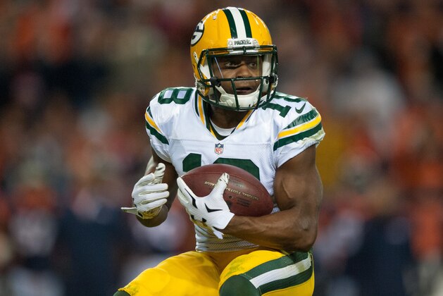 DENVER, CO - NOVEMBER 1: Wide receiver Randall Cobb #18 of the Green Bay Packers carries the ball against the Denver Broncos at Sports Authority Field at Mile High on November 1, 2015 in Denver, Colorado. (Photo by Dustin Bradford/Getty Images)