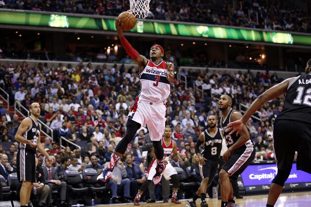 Washington Wizards guard Bradley Beal (3)  shoots in the second half of an NBA basketball game against the San Antonio Spurs, Wednesday, Nov. 4, 2015, in Washington. The Wizards won 102-99.  (AP Photo/Alex Brandon)