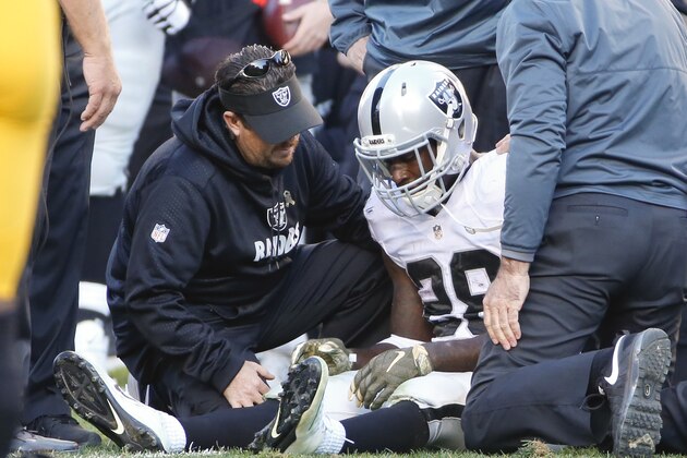 Oakland Raiders running back Latavius Murray (28) is tended to after being injured in an NFL football game against the Pittsburgh Steelers, Sunday, Nov. 8, 2015, in Pittsburgh. The Steelers won 38-35. (AP Photo/Gene J. Puskar)