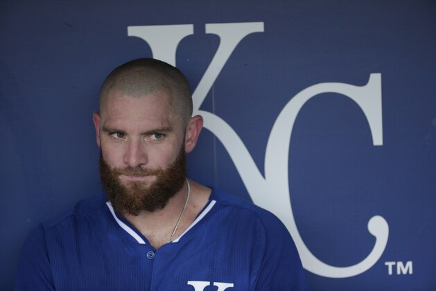 Kansas City Royals' Jonny Gomes sits in the dugout before a baseball game against the Detroit Tigers Tuesday, Sept. 1, 2015, in Kansas City, Mo. (AP Photo/Charlie Riedel)