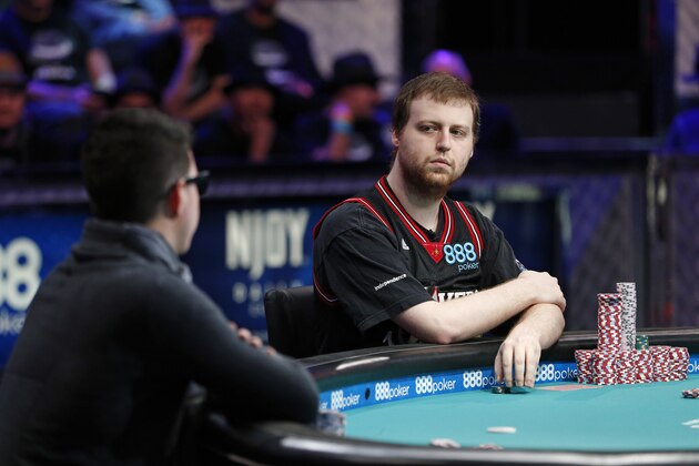 Joseph McKeehen, right, looks over at Joshua Beckley during the World Series of Poker Tuesday, Nov. 10, 2015, in Las Vegas. Tuesday is the third of three days of marathon-length poker-playing before crowning a new champion and awarding more than $7 million to the winner. (AP Photo/John Locher)