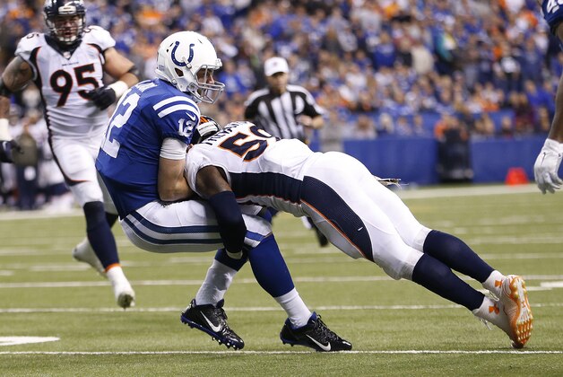 Indianapolis Colts' Andrew Luck (12) is tackled by Denver Broncos' Danny Trevathan (59) during the second half of an NFL football game, Sunday, Nov. 8, 2015, Indianapolis. (AP Photo/AJ Mast)