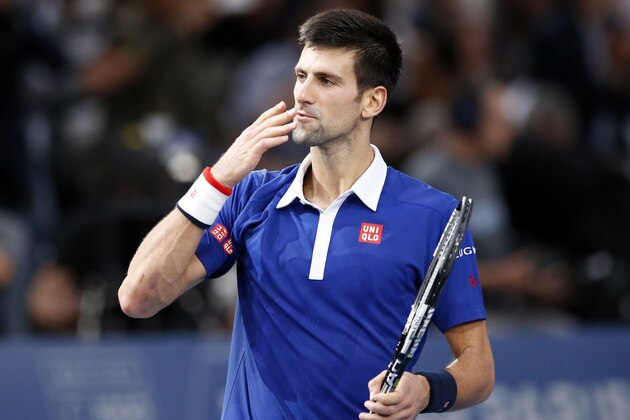 Serbia's Novak Djokovic blows a kiss on the match point to win Britain's Andy Murrray during their final match of the BNP Masters tennis tournament at the Paris Bercy Arena in Paris, France, Sunday, Nov. 8, 2015. Djokovic wins 6-2, 6-4. (AP Photo/Francois Mori)
