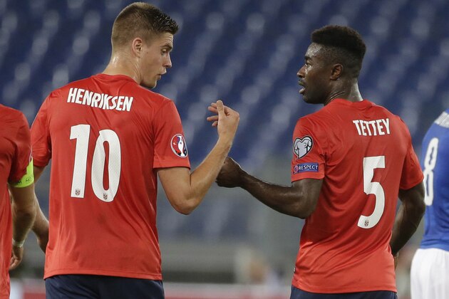 Norway Alexander Tettey, right, celebrates with his teammate Markus Henriksen after he scored during a Euro 2016 qualifying group H soccer match  at Rome's Olympic Stadium, Tuesday, Oct. 13, 2015.  (AP Photo/Andrew Medichini)