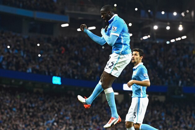 MANCHESTER, ENGLAND - OCTOBER 31:  Yaya Toure of Manchester City celebrates scoring his team's second goal from the penalty spot during the Barclays Premier League match between Manchester City and Norwich City at Etihad Stadium on October 31, 2015 in Manchester, England.  (Photo by David Ramos/Getty Images)