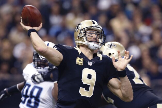 New Orleans Saints quarterback Drew Brees (9) passes in the first half of an NFL football game against the Tennessee Titans in New Orleans, Sunday, Nov. 8, 2015. (AP Photo/Jonathan Bachman)