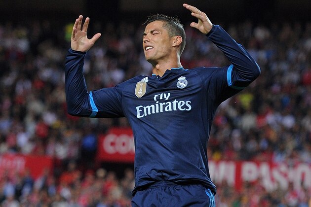SEVILLE, SPAIN - NOVEMBER 08: (EDITORS NOTE: Retransmission of #496306432 with alternate crop.) Cristiano Ronaldo of Real Madrid reacts after his shot at goal was saved during the La Liga match between Sevilla FC and Real Madrid CF at Estadio Ramon Sanchez Pizjuan on November 8, 2015 in Seville, Spain.  (Photo by Denis Doyle/Getty Images)