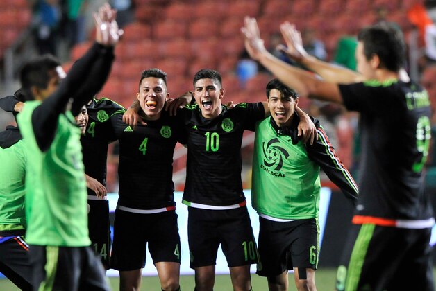 SANDY UT- OCTOBER 13: Carlos Salcedo #4, Victor Guzman #10 and Erick Gutierrez #6 all of Mexico, watch and participate in the celebration after they beat Honduras 2-0 in the final CONCACAF Olympic Qualifying match at Rio Tinto Stadium on October 13, 2015 in Sandy, Utah. (Photo by Gene Sweeney Jr/Getty Images)