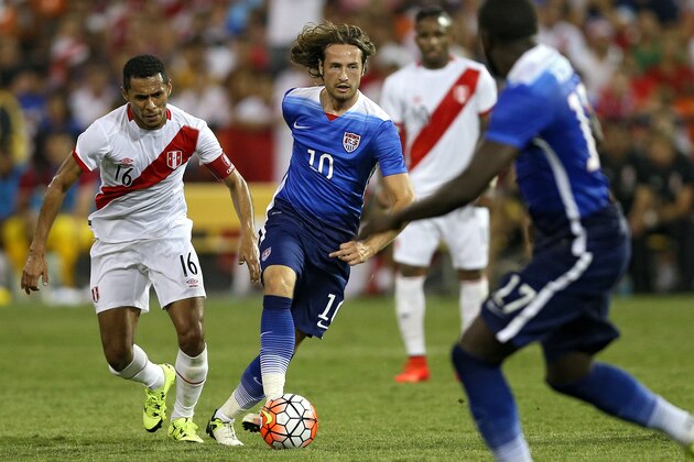 WASHINGTON, DC - SEPTEMBER 04: Mix Diskerud #10 of the United States dribbles past Carlos Lobaton #16 of Peru in the second half during an international friendly at RFK Stadium on September 4, 2015 in Washington, DC. (Photo by Patrick Smith/Getty Images)