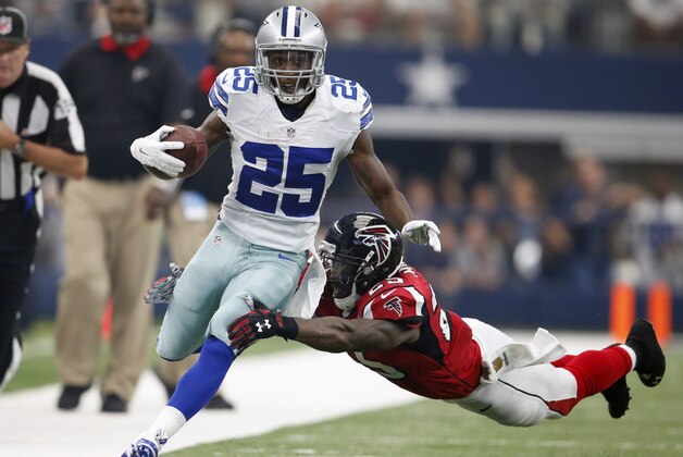 Sep 27, 2015; Arlington, TX, USA; Dallas Cowboys running back Joseph Randle (21) scores a first quarter touchdown against Atlanta Falcons safety William Moore (25) at AT&T Stadium. Mandatory Credit: Matthew Emmons-USA TODAY Sports