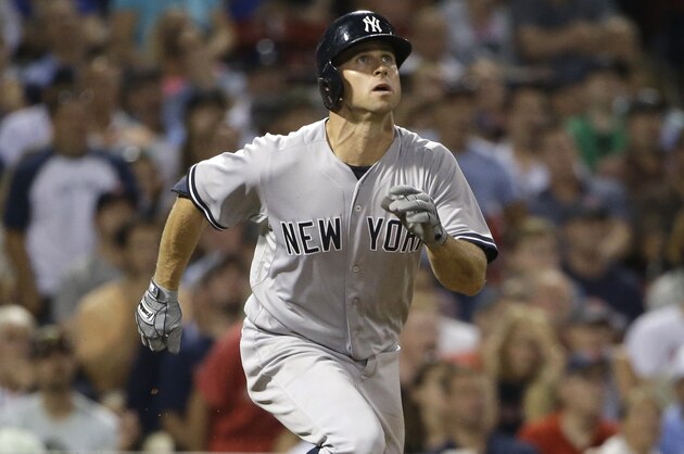 New York Yankees' Brett Gardner watches the flight of his home run in the eighth inning of a baseball game against the Boston Red Sox, Tuesday, Sept. 1, 2015, at Fenway Park, in Boston. (AP Photo/Steven Senne)