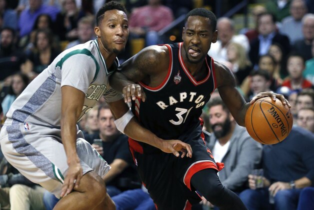 Toronto Raptors' Terrence Ross (31) drives past Boston Celtics' Evan Turner (11) during the fourth quarter of an NBA basketball game in Boston, Friday, Oct. 30, 2015. The Raptors won 113-103. (AP Photo/Michael Dwyer)
