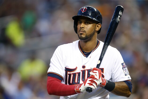 Minnesota Twins’ Aaron Hicks is on deck in  a baseball game against the Detroit Tigers, Tuesday, Sept. 15, 2015, in Minneapolis. (AP Photo/Jim Mone)