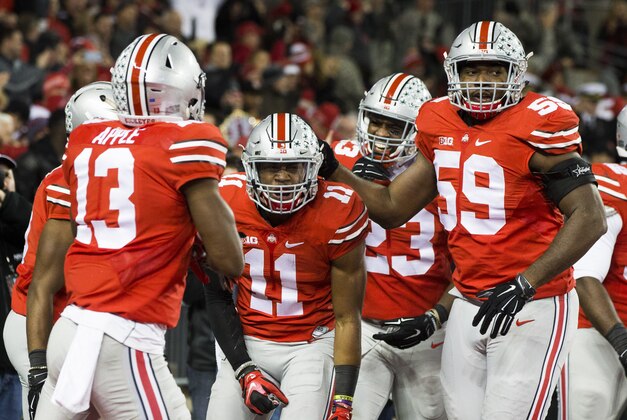 Nov 7, 2015; Columbus, OH, USA; Ohio State Buckeyes safety Vonn Bell (11) is congratulated by teammates after returning an interception for a touchdown at Ohio Stadium. Mandatory Credit: Greg Bartram-USA TODAY Sports