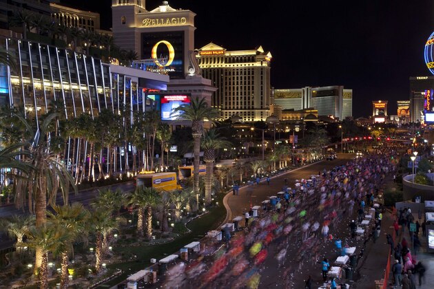 Runners stream southward on Las Vegas Boulevard during the Rock 'n Roll Las Vegas Marathon, Sunday, Dec. 4, 2011, in Las Vegas. Forty five thousand participants ran in a marathon and half marathon filling the shut-down Strip. (AP Photo/Julie Jacobson)