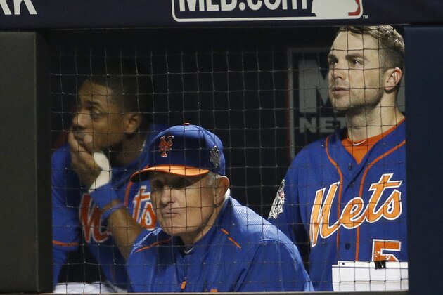 New York Mets manager Terry Collins watches with David Wright, right, the 11th inning of Game 5 of the Major League Baseball World Series against the Kansas City Royals Sunday, Nov. 1, 2015, in New York. (AP Photo/Matt Slocum)