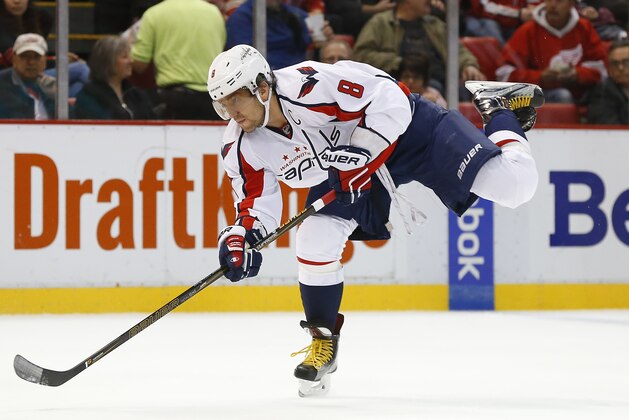 Washington Capitals left wing Alex Ovechkin shoots against the Detroit Red Wings in the first period of an NHL hockey game Tuesday, Nov. 10, 2015 in Detroit. (AP Photo/Paul Sancya)