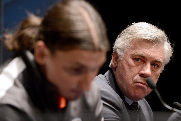 Paris Saint-Germain's Swedish forward Zlatan Ibrahimovic (L) and Paris Saint-Germain's coach Carlo Ancelotti give a press conference on April 1, 2013 at the Parc-des-Princes stadium in Paris, on the eve of the UEFA Champions League quarter-final football match Paris Saint-Germain vs FC Barcelona.  AFP PHOTO / FRANCK FIFE        (Photo credit should read FRANCK FIFE/AFP/Getty Images)