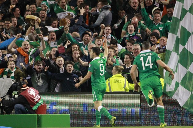 Ireland's Shane Long celebrates with fans after scoring the opening goal during the Euro 2016 group D qualifying soccer match between Ireland and Germany in Dublin, Ireland, Thursday, Oct. 8, 2015. (AP Photo/Peter Morrison)