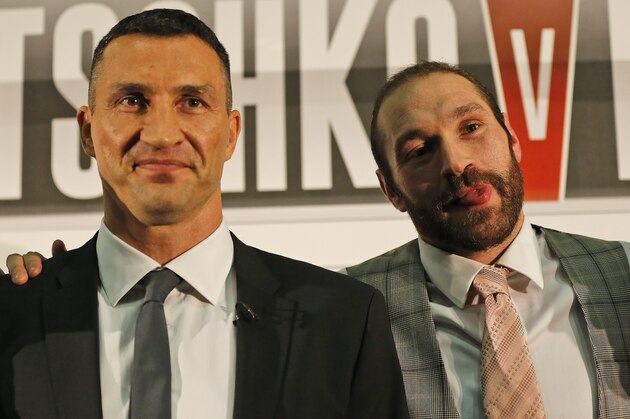 WBA, WBO, IBF, and IBO heavyweight boxer, Wladimir Klitschko, left, and British heavyweight Tyson Fury pose for photographers during a press conference for their heavyweight title bout on October 24, 2015 in Duesseldorf, Germany, in London, Wednesday, Sept. 23, 2015.(AP Photo/Frank Augstein) WBA, WBO, IBF, and IBO heavyweight boxer, Wladimir Klitschko, left, and British heavyweight Tyson Fury pose for photographers during a press conference for their heavyweight title bout on October 24, 2015 in Duesseldorf, Germany, in London, Wednesday, Sept. 23, 2015.(AP Photo/Frank Augstein)