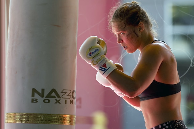 FILE - This July 15, 2015, file photo shows mixed martial arts fighter Ronda Rousey working out at Glendale Fighting Club in Glendale, Calif. Paramount Pictures said Monday, Aug. 3, that it has acquired the rights to Rousey’s autobiography “My Fight/Your Fight,” with plans for Rousey to play herself in the adaptation. (AP Photo/Jae C. Hong, File)
