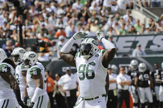 New York Jets defensive end Muhammad Wilkerson (96) gestures to the corwd during the first half of an NFL football game against the Oakland Raiders Sunday, Sept. 7, 2014, in East Rutherford, N.J. (AP Photo/Bill Kostroun)