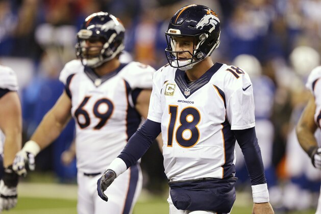 Denver Broncos quarterback Peyton Manning (18) walks off the field after throwing an interception during the second half of an NFL football game against the Indianapolis Colts, Sunday, Nov. 8, 2015, Indianapolis. The Colts won 27-24. (AP Photo/Michael Conroy)
