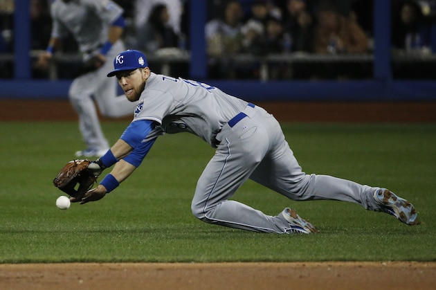 Kansas City Royals second baseman Ben Zobrist fields the ball on a single by New York Mets' Curtis Granderson during the first inning of Game 3 of the Major League Baseball World Series Friday, Oct. 30, 2015, in New York. (AP Photo/Matt Slocum)