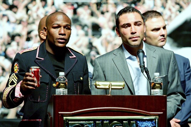 LAS VEGAS - MAY 05:  Floyd Mayweather Jr. (L) and Oscar De La Hoya speak at a news conference after Mayweather defeated De La Hoya by split decision in their WBC super welterweight championship fight at the MGM Grand Garden Arena May 5, 2007 in Las Vegas, Nevada.  (Photo by Ethan Miller/Getty Images)