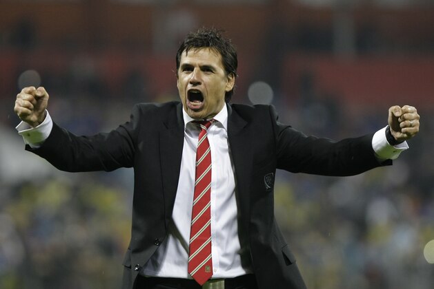 Wales' national team Chris Coleman celebrates after the Euro 2016 Group B qualifying match between Bosnia-Herzegovina and Wales, at the Bilino Polje stadium in Zenica, Bosnia, Saturday, Oct. 10, 2015. (AP Photo/Amel Emric)