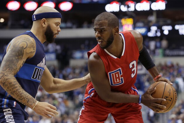 Los Angeles Clippers guard Chris Paul (3) is defended by Dallas Mavericks guard Deron Williams (8) during the first half of an NBA basketball game Wednesday, Nov. 11, 2015, in Dallas. (AP Photo/LM Otero)