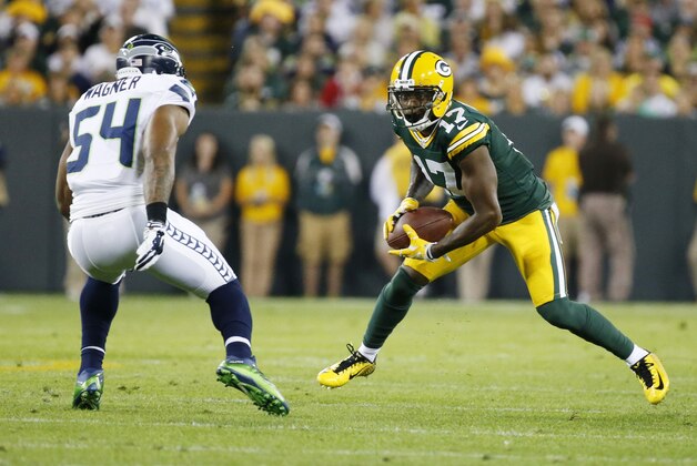 Green Bay Packers' Davante Adams catches a pass in front of Seattle Seahawks' Bobby Wagner during the first half of an NFL football game Sunday, Sept. 20, 2015, in Green Bay, Wis. (AP Photo/Mike Roemer)