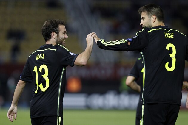 Spain's Juan Mata, left, is congratulated by teammate Gerard Pique after scoring the opening goal against Macedonia during the Euro 2016 qualifying match between Macedonia and Spain at the Philip II stadium, in Skopje, Tuesday, Sept. 8, 2015. (AP Photo/Vlatko Perkovski) Spain's Juan Mata, left, is congratulated by teammate Gerard Pique after scoring the opening goal against Macedonia during the Euro 2016 qualifying match between Macedonia and Spain at the Philip II stadium, in Skopje, Tuesday, Sept. 8, 2015. (AP Photo/Vlatko Perkovski)