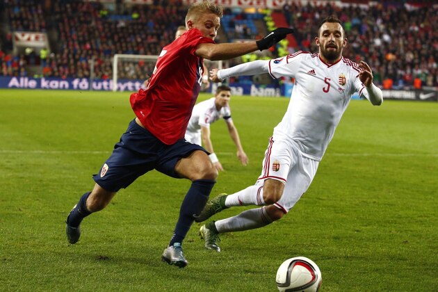 Norway's captain Per Ciljan Skjelbred and Hungary's defender Attila Fiola vie for the ball during the first-leg play off qualifier football match for the UEFA 2016 European Championship in France on Novemebr 12, 2016 in Oslo, Norway. AFP PHOTO / NTB SCANPIX / HEIKO JUNGE +++ NORWAY OUT +++        (Photo credit should read HEIKO JUNGE/AFP/Getty Images)