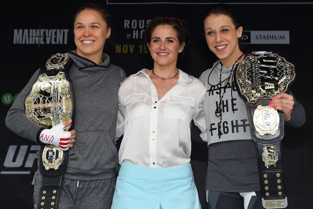 MELBOURNE, AUSTRALIA - NOVEMBER 12:  2015 Melbourne Cup champion jockey Michelle Payne poses with UFC women's bantamweight champion Ronda Rousey (L) of the United States and UFC women's strawweight champion Joanna Jedrzejczyk (R) of Poland on stage during the UFC 193 open workouts at Federation Square on November 12, 2015 in Melbourne, Australia. (Photo by Josh Hedges/Zuffa LLC/Zuffa LLC via Getty Images)