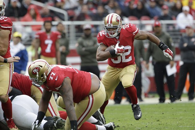 San Francisco 49ers running back Pierre Thomas (32) runs against the Atlanta Falcons during the first half of an NFL football game in Santa Clara, Calif., Sunday, Nov. 8, 2015. (AP Photo/Marcio Jose Sanchez)