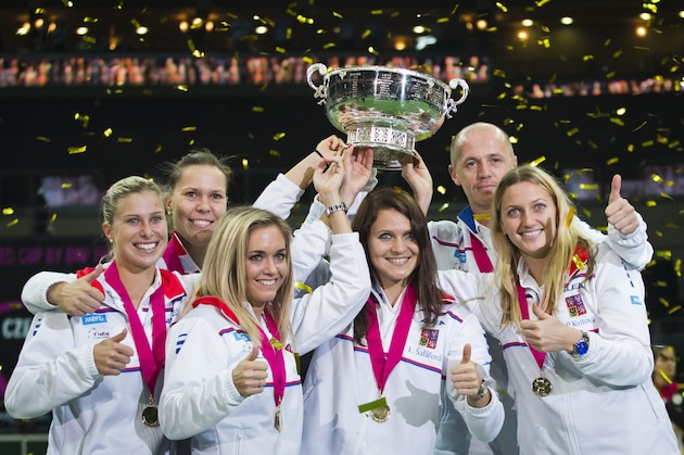 PRAGUE, CZECH REPUBLIC - NOVEMBER 09:  (L-R) Andrea Hlavackova, Lucie Hradecka, Klara Koukalova, Lucie Safarova, team captain Petr Pala and Petra Kvitova of Czech Republic pose with the trophy after victory over Germany in the Fed Cup final at O2 Arena on November 9, 2014 in Prague, Czech Republic.  (Photo by Matej Divizna/Getty Images)